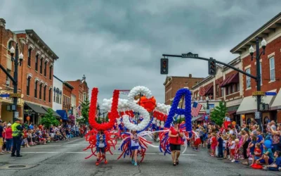 Bring a folding chair and catch the July 4th parade in Uptown!